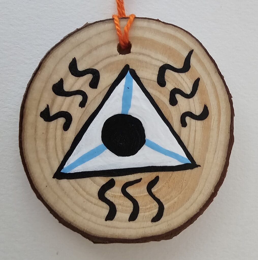 A wooden disc with a triangle on it