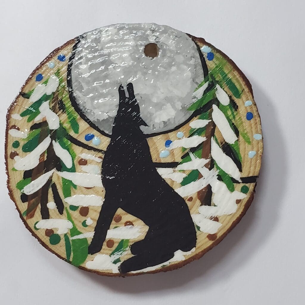 A plate with a dog and tree design on it