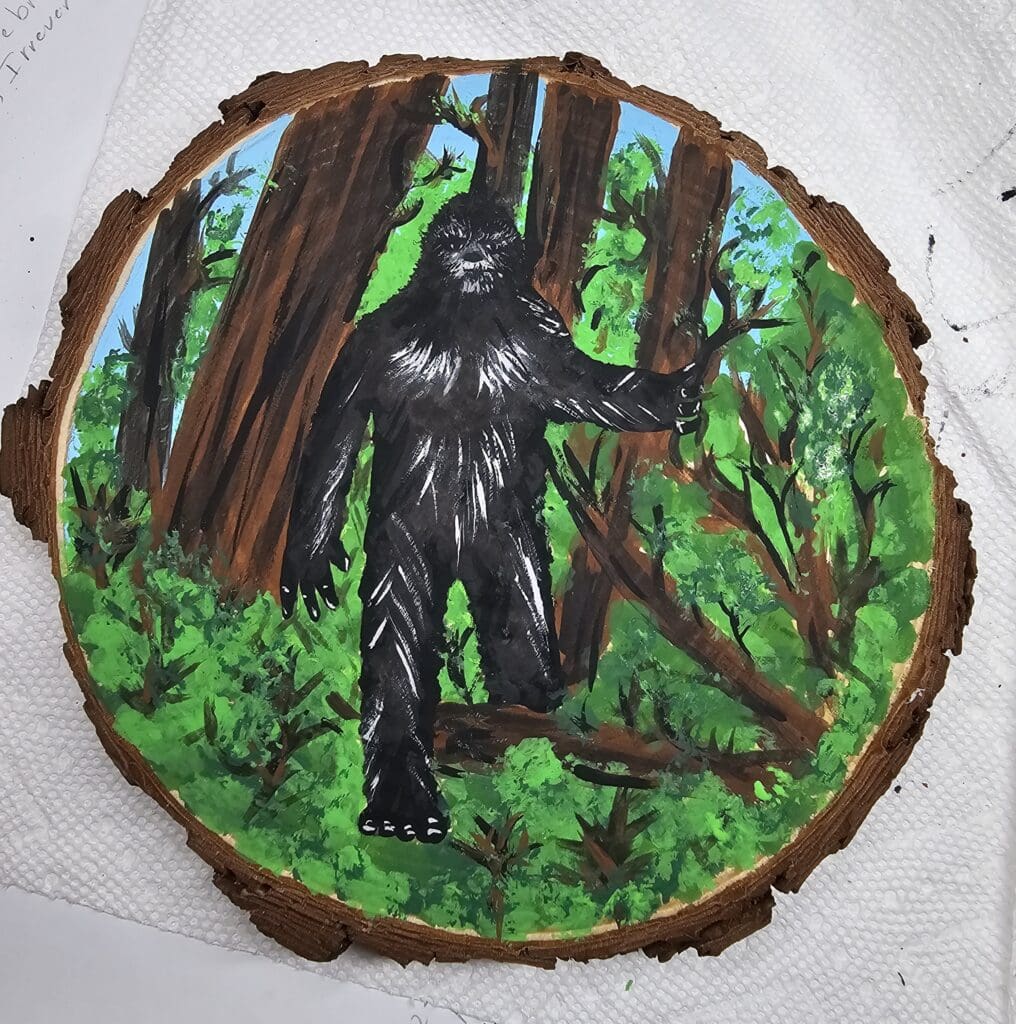 A painting of a gorilla in the woods