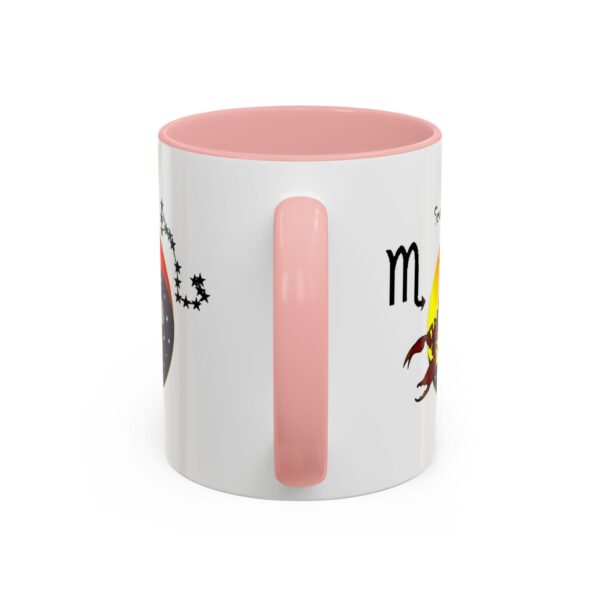 A pink and white mug with the words " scorpio " written on it.