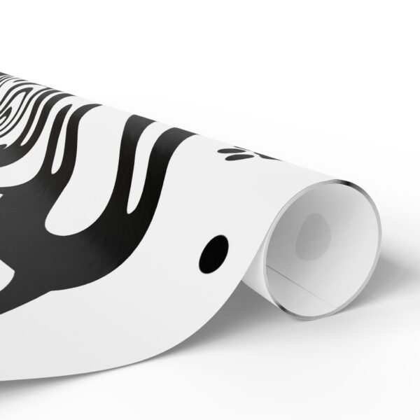 A roll of black and white paper with a zebra design.