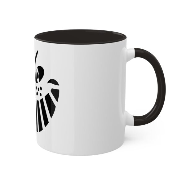 A black and white coffee mug with the symbol of an eagle.