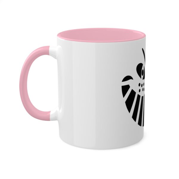 A pink and white coffee mug with the symbol for an animal.