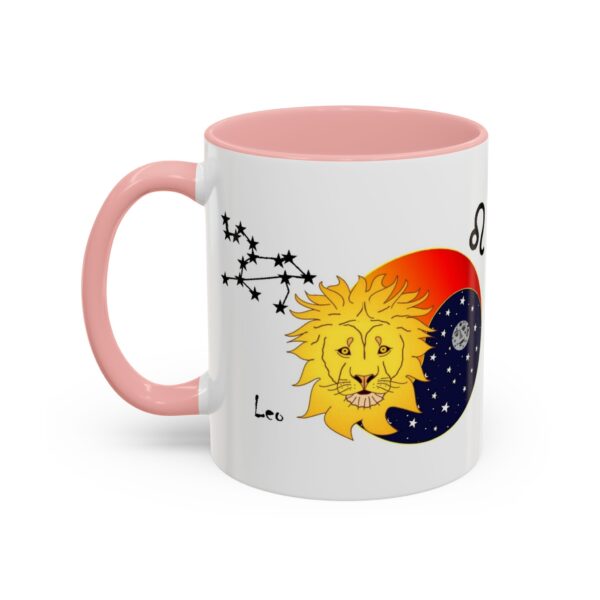 A pink and white mug with a picture of a sun, moon, and stars.