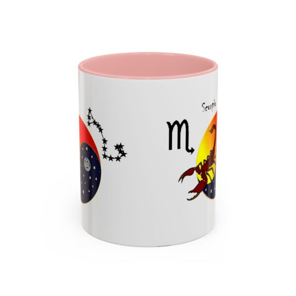 A pink and white mug with the zodiac sign scorpio on it.