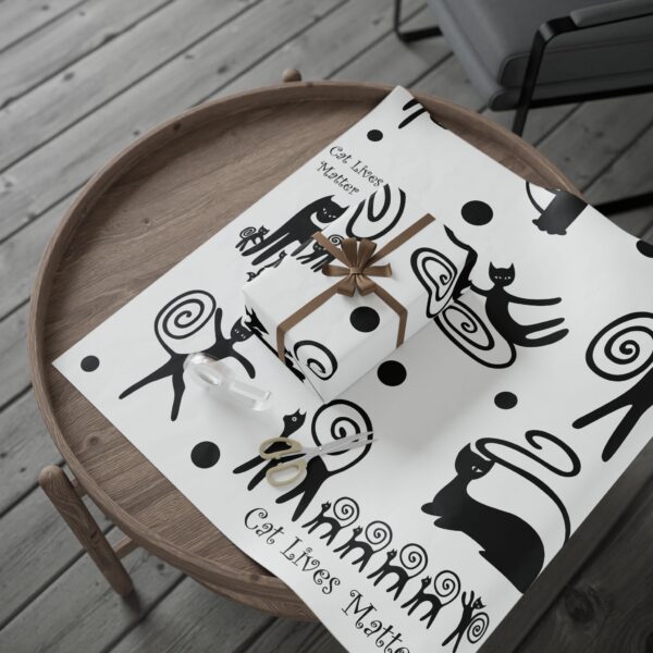 A cat themed placemat on top of a wooden table.