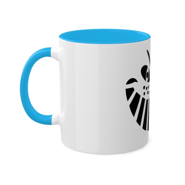 A blue and white coffee mug with the symbol for the shield.