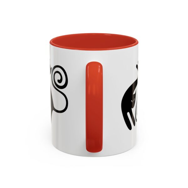 A red and white coffee mug with an image of a monkey.