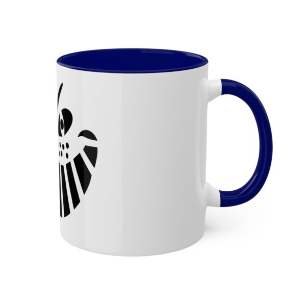 A white and blue coffee mug with the shield of loki on it.