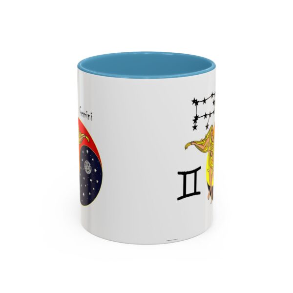 A blue and white mug with the zodiac sign gemini on it.