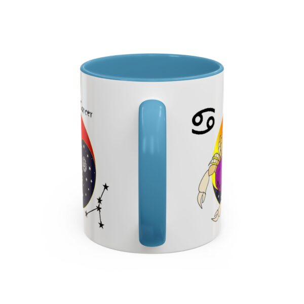 A blue and white mug with an image of the zodiac sign.