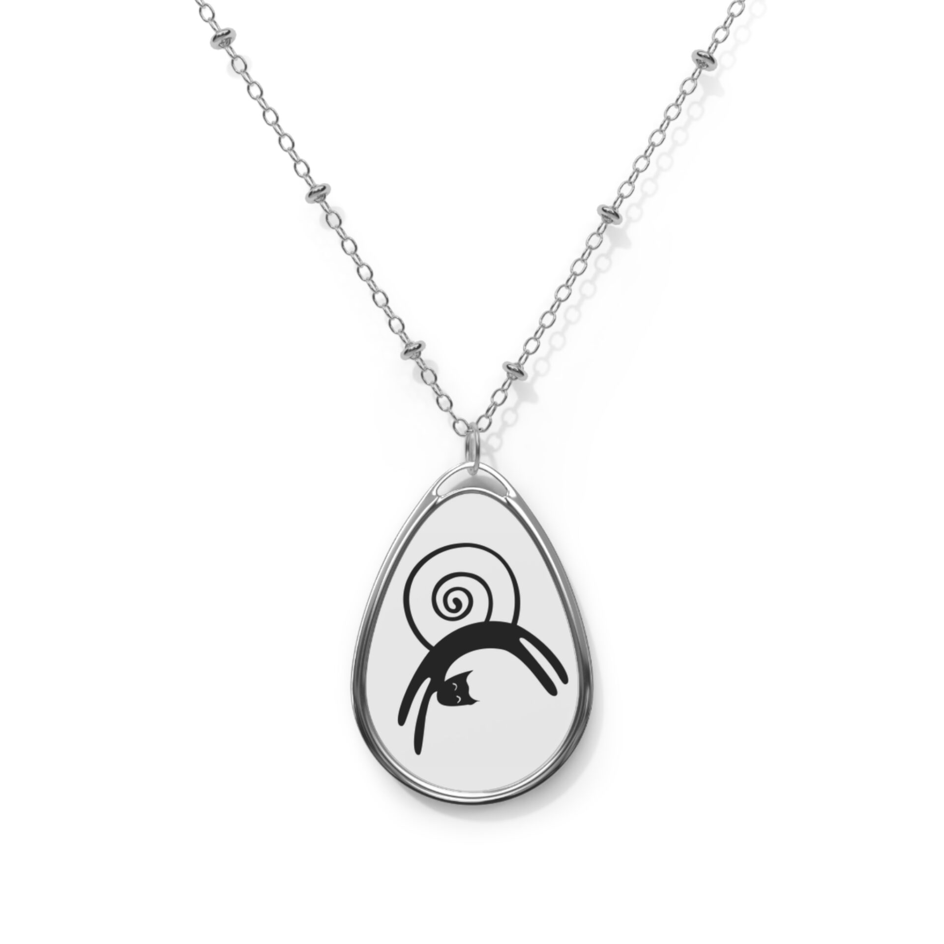 A necklace with a black and white design on it.