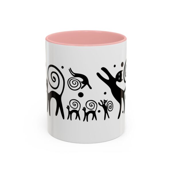 A pink and white mug with an animal design on it.