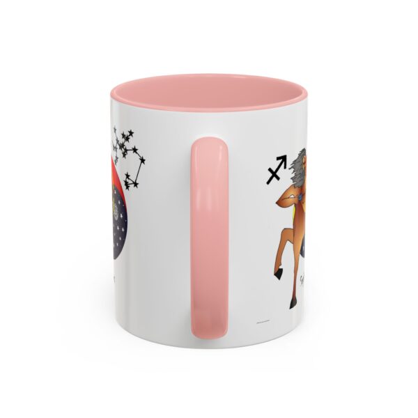 A pink mug with an animal design on it.