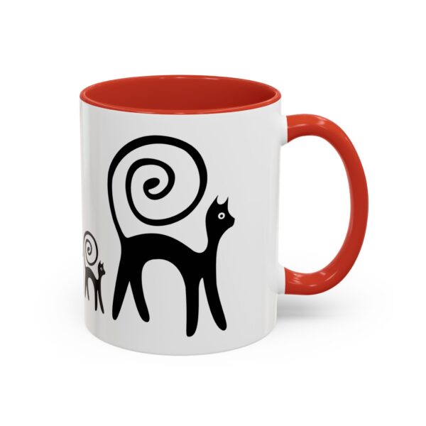 A red and white mug with an image of two cats