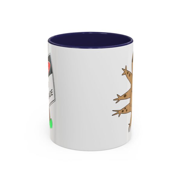 A white and blue mug with a picture of a lizard.