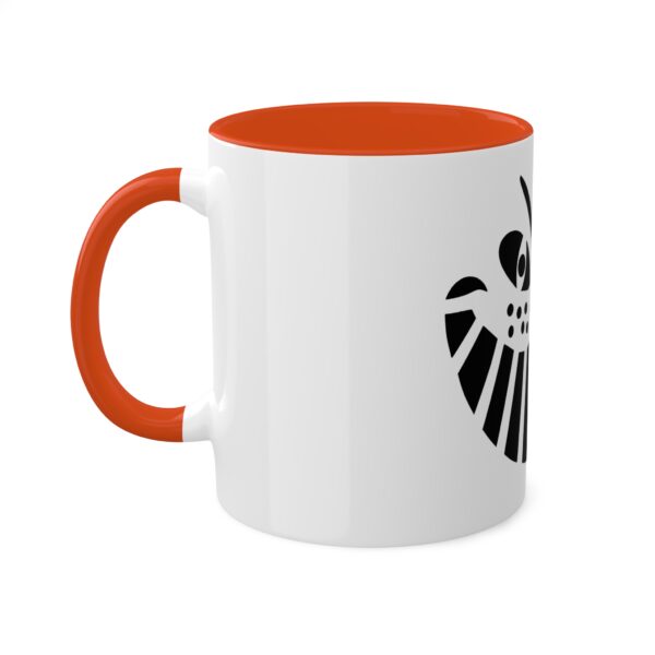 A white and orange mug with an image of a skull.