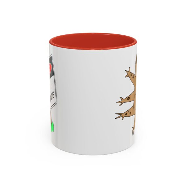 A red and white mug with a picture of a lizard.