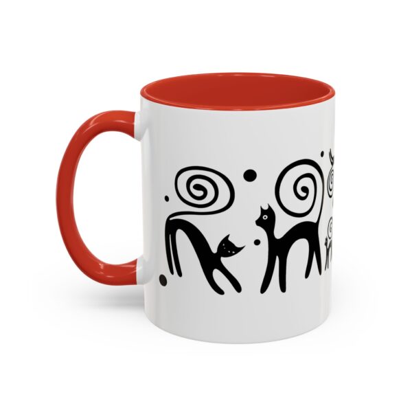 A red and white mug with an image of two cats.