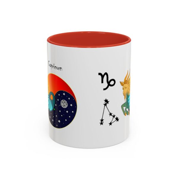 A red and white mug with an image of the zodiac