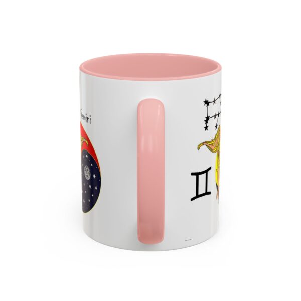 A pink and white mug with the words " gemini ".