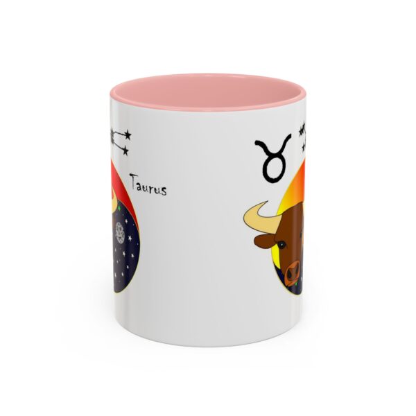 A pink and white mug with an image of a bull.