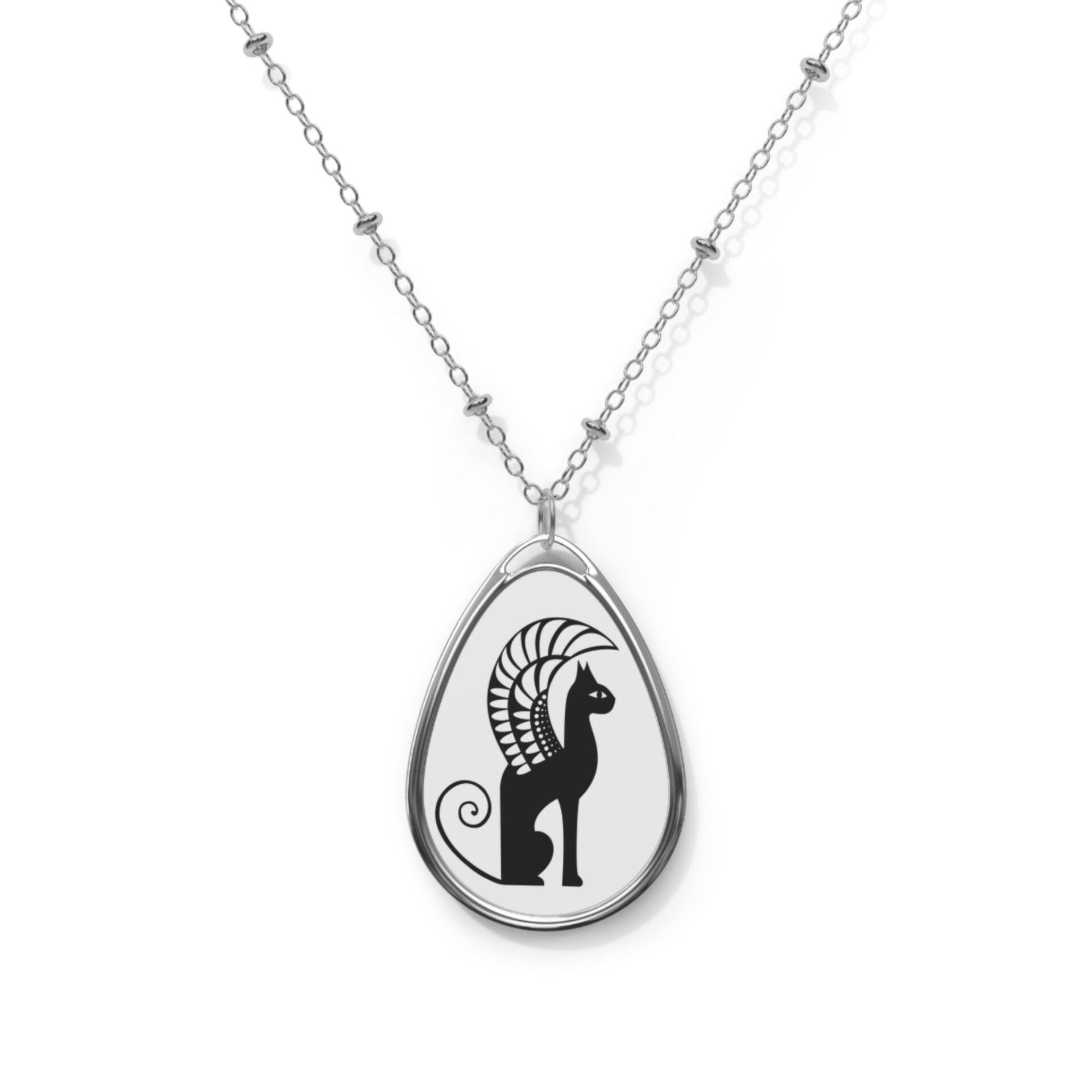 A necklace with an image of a cat on it.