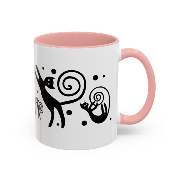 A pink and white mug with an animal design on it.