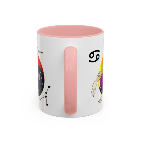 A pink coffee mug with an image of a girl and a rainbow.