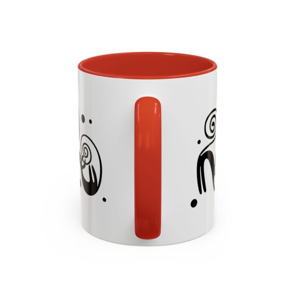 A red and white mug with an image of a person 's face.