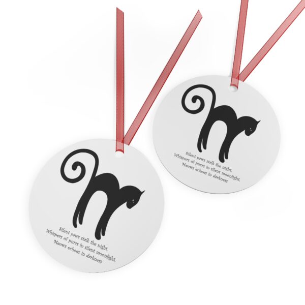 A pair of round tags with the letter m and cat.