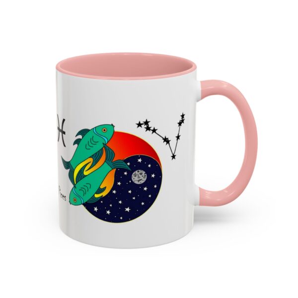 A pink and white mug with an illustration of a space ship.