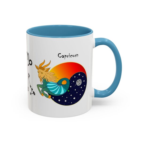 A blue and white coffee mug with an astrology design.