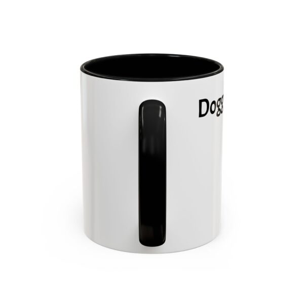 A white mug with black handle and the word " do something ".