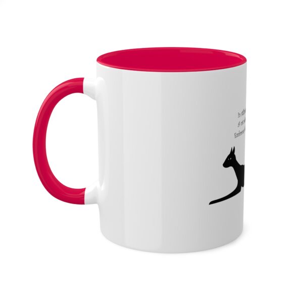 A red and white mug with a kangaroo on it