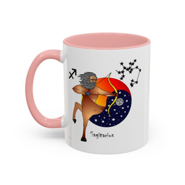 A pink and white mug with a picture of taurus