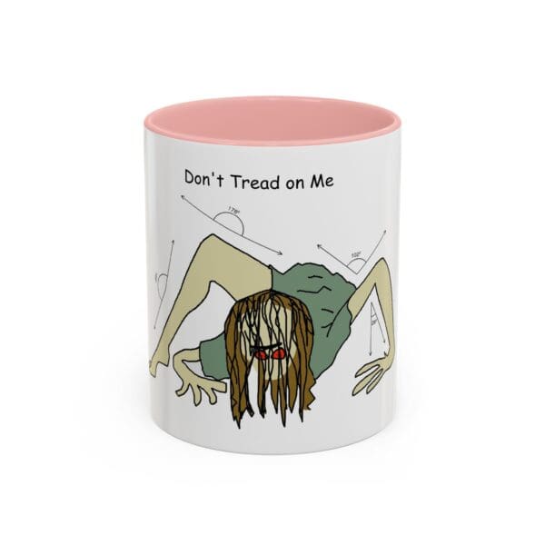 A pink and white mug with an image of a zombie.