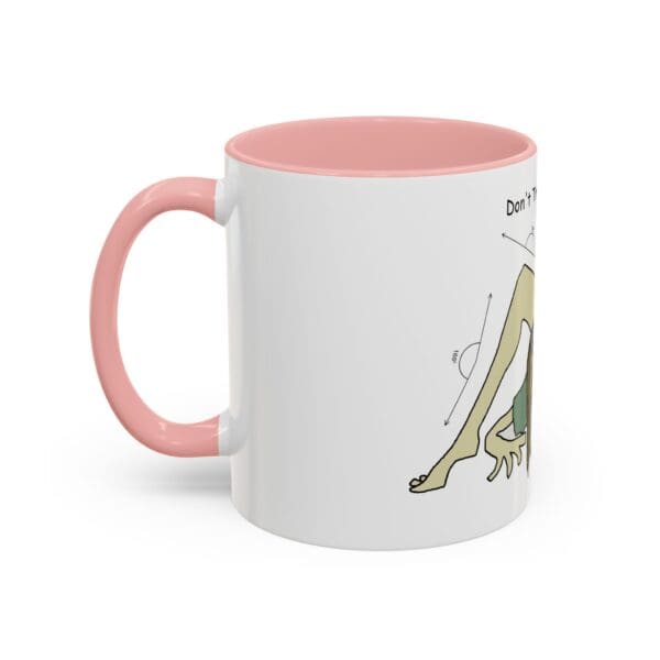 A pink and white mug with a drawing of a frog