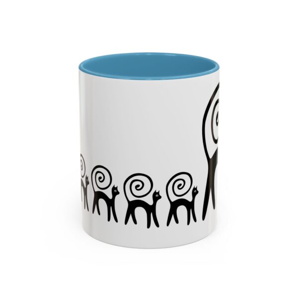 A mug with an image of a tree and people.