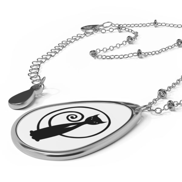 A necklace with a black and white design on it