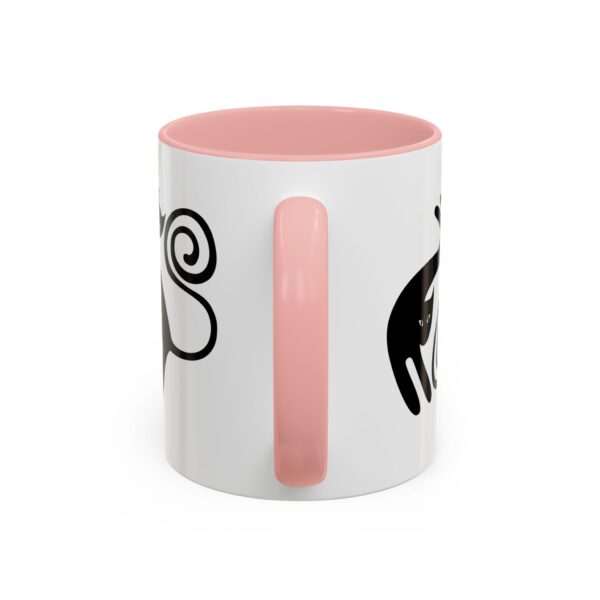 A pink and white coffee mug with a design on it.