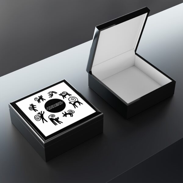 A black and white box with a ring inside of it