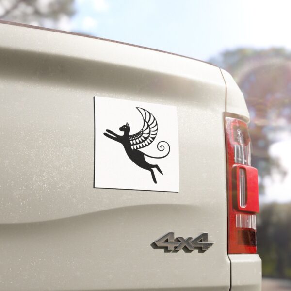 A sticker of an angel on the back of a car.