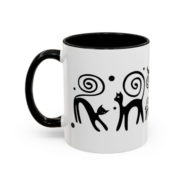 A black and white mug with an abstract design.