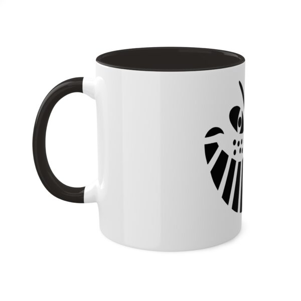 A black and white coffee mug with the symbol for the marvel comics.