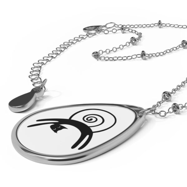 A necklace with a black and white design on it