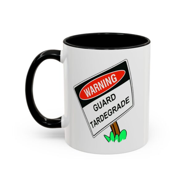 A black and white mug with a warning sign on it