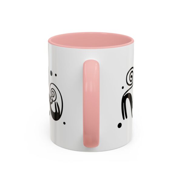 A pink and white mug with a design on it.