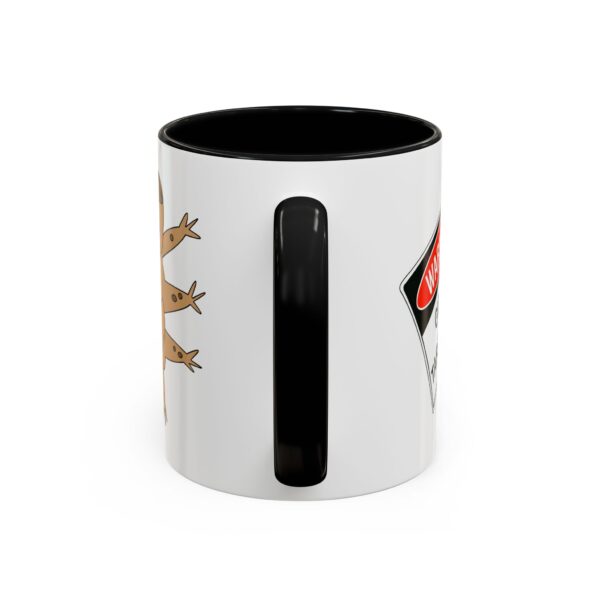 A black and white mug with a picture of animals.