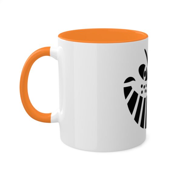 A white and orange mug with an image of a skull.